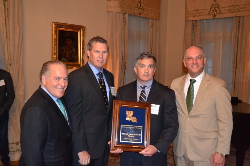 Accepting the award was Ear, Nose and Throat of New Orleans Partner Dr. Greg Pippin, center right, joined by (from left) Louisiana Economic Development Secretary Don Pierson, LQF President Gordon Payne and Louisiana Governor John Bel Edwards.