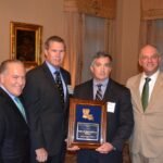 Accepting the award was Ear, Nose and Throat of New Orleans Partner Dr. Greg Pippin, center right, joined by (from left) Louisiana Economic Development Secretary Don Pierson, LQF President Gordon Payne and Louisiana Governor John Bel Edwards.